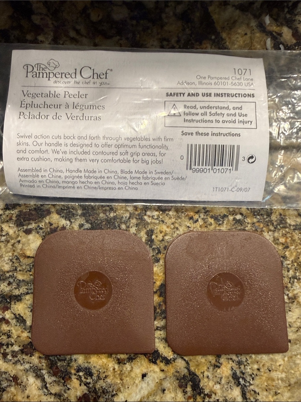The Pampered Chef Vegetable Peeler with 2 Pampered Chef Kitchen Scrapers